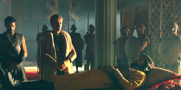 Alexander standing respectfully over Darius' corpse in Alexander: The Making of a God.