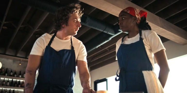 Jeremy Allen White as Carmy and Ayo Edibiri as Sydney in The Bear