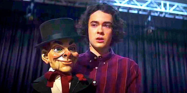 A shocked Harold stares at Slappy the dummy onstage in Goosebumps 2023