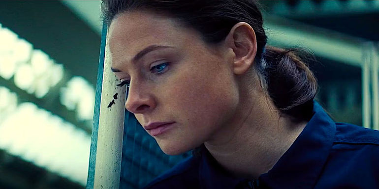 Rebecca Ferguson looking down in Mission: Impossible - Rogue Nation