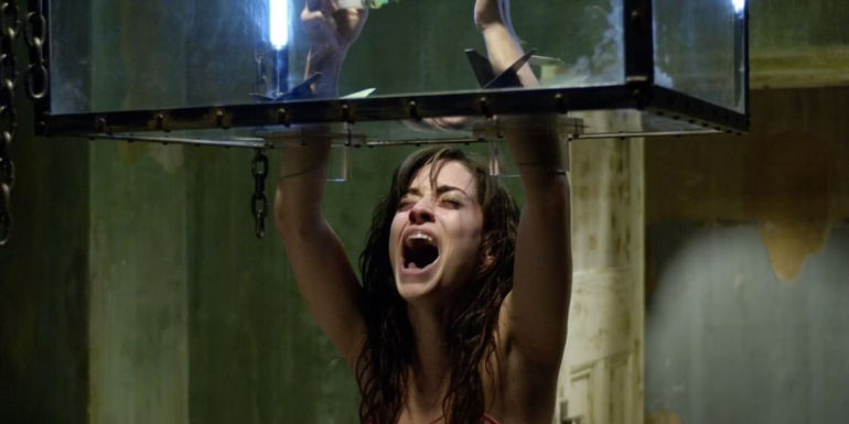 Addison in the razor box trap from the second Saw film