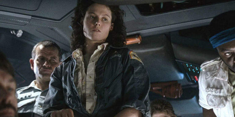 Sigourney Weaver as Ellen Ripley with Ian Holm as Ash behind her In Alien 1979