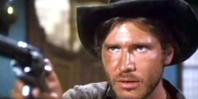 Harrison Ford pointing a gun. 