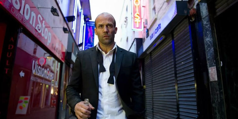 Jason Statham as Joey walking down a street in Redemption