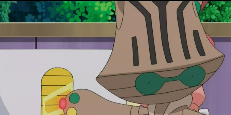 Pokemon: Beheeyem points out the coin they're searching for.