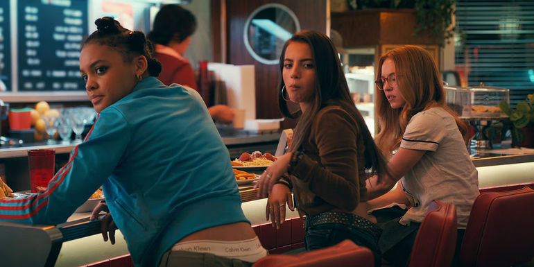 Madame Web three young women at a small restaurant
