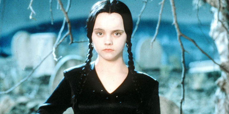 Christina Ricci as Wednesday Addams in a graveyard in The Addams Family
