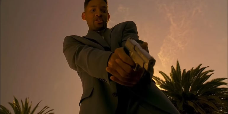 Will Smith holds a gun in Bad Boys.
