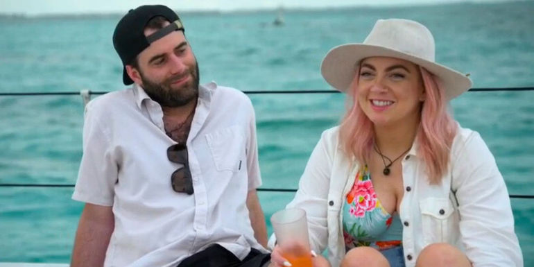 Becca and Austin from Married at First Sight season 17 sitting on a boat