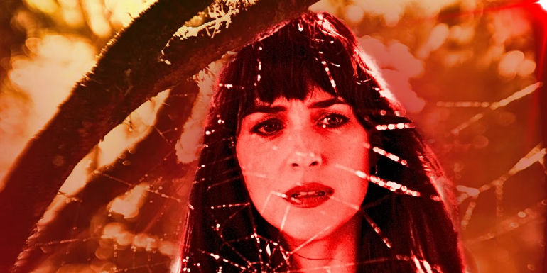 Dakota Johnson as Cassandra Webb in front of a spider-web In Madame Web