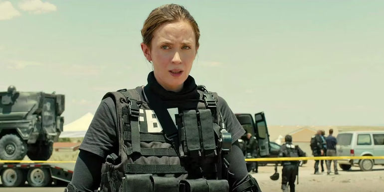 Emily Blunt as Kate Mercer wearily looks on after securing a crime scene in Sicario.