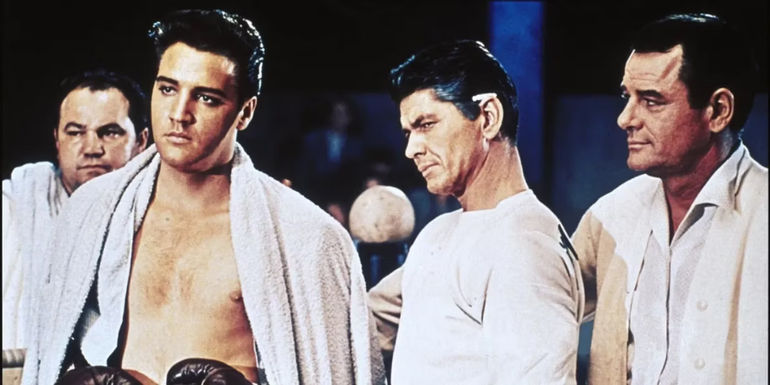 Elvis Presley as a boxer surrounded by his team in Kid Galahad