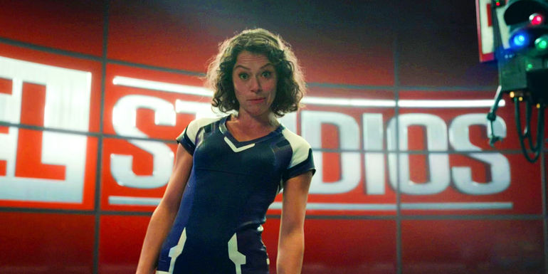 Tatiana Maslany as Jennifer Walters Looking Into The Camera With The Marvel Studios Logo Behind Her In She-Hulk Season 1 Finale
