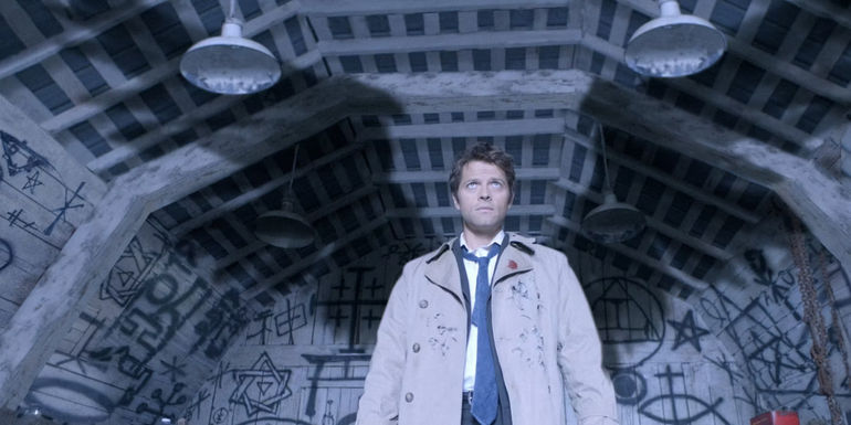 Castiel stood under a graffitied tunnel in Supernatural