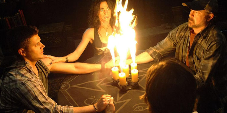 Dean, Sam, Traci, and Bobby using a ouja board in Supernatural