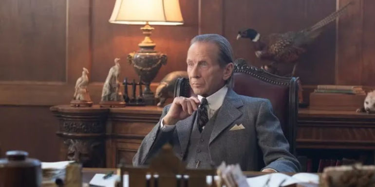 Lydell (Paul Raci) sitting behind his desk looking concerned in Perry Mason.