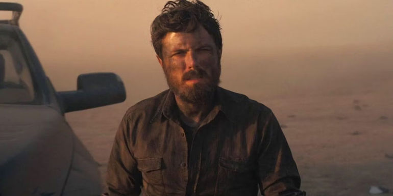 Tom (Casey Affleck) covered in dirt in Interstellar.