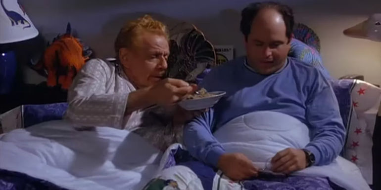 Frank offering George food in bed in Seinfeld
