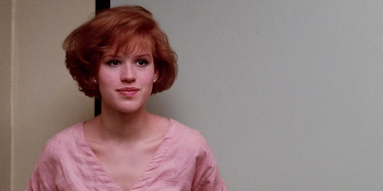 Claire (Molly Ringwald) with a soft smile in The Breakfast Club