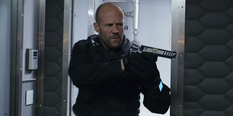 Deckard Shaw pointing a gun in The Fate of the Furious