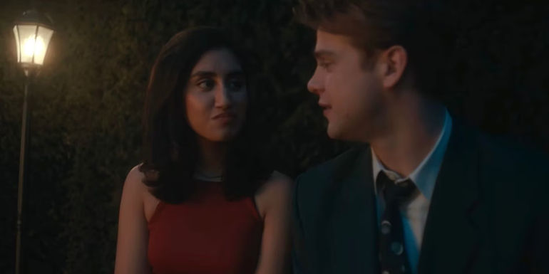 Dexter and Emma sitting together in the maze. 