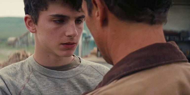 Matthew McConaughey as Joseph Cooper talking to Timothée Chalamet as young Tom in Interstellarr.