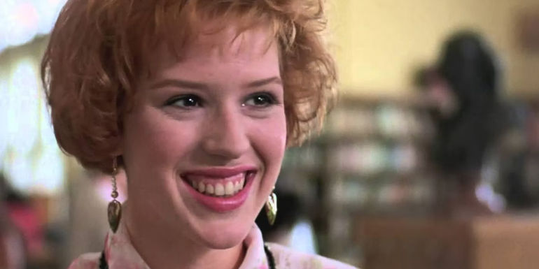 Molly Ringwald smiling in Pretty in Pink