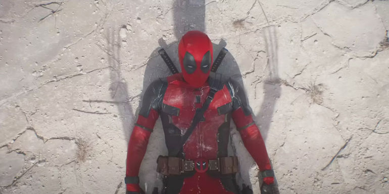 Wolverine standing over Deadpool in Deadpool and Wolverine