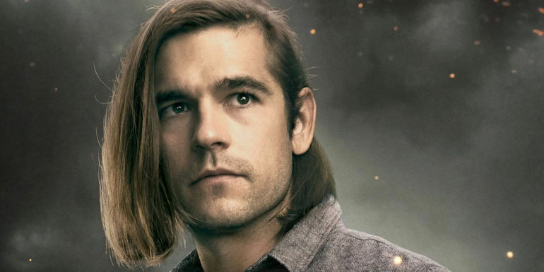 A closeup of Quentin in front of grey smoke for The Magicians