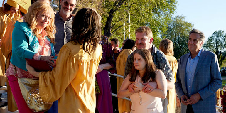 Bea's family celebrates her high school graduation.