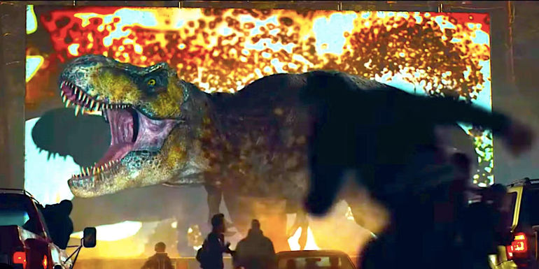 A T rex roars in front of a drive in cinema screen in Jurassic World Dominion's missing prologue