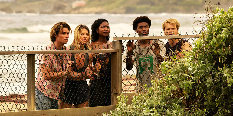 John B, Sarah, Cleo, Pope, and JJ looking over a fence in Outer Banks Season 3.