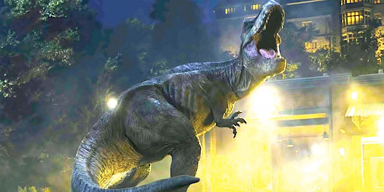 The T-rex roars outside a mansion at night in Jurassic World Fallen Kingdom-1