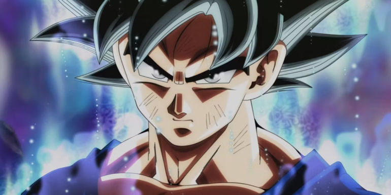 Screenshot from Dragon Ball Super anime shows Goku unlocking the first phase of Ultra Instinct where his hair is black with a silver highlight and his eyes are silver.