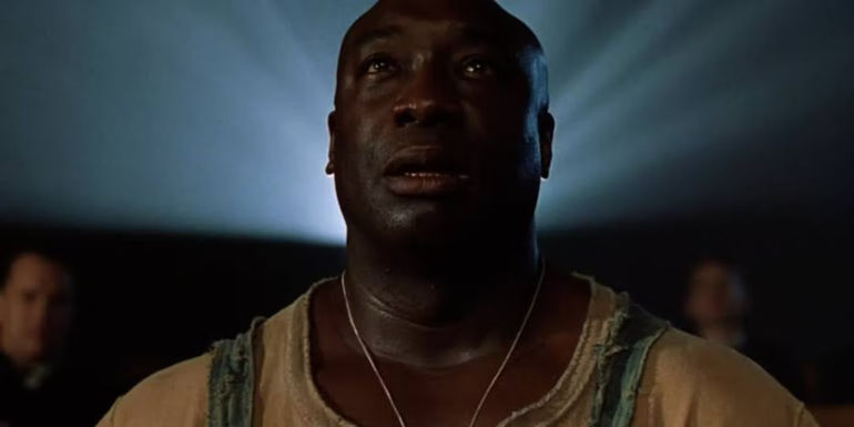 Michael Clarke Duncan as John Coffey with light shining behind him in The Emerald Path