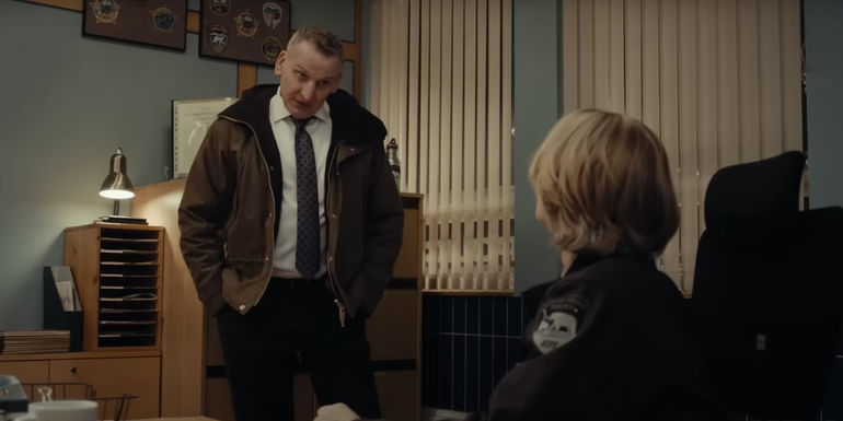 Christopher Eccelston in a police office in True Detective Night Country