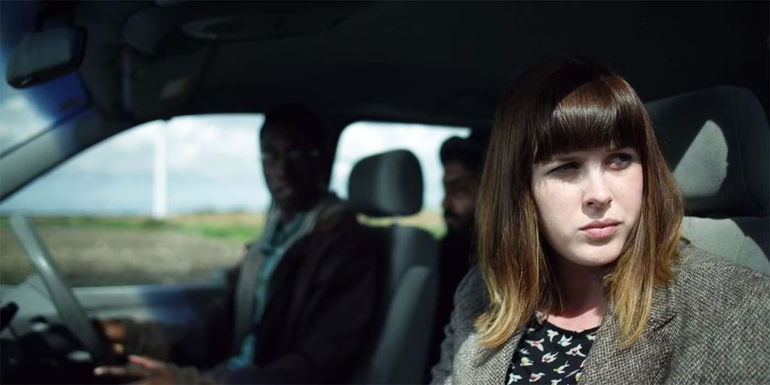 Alexander Roach in a car with someone