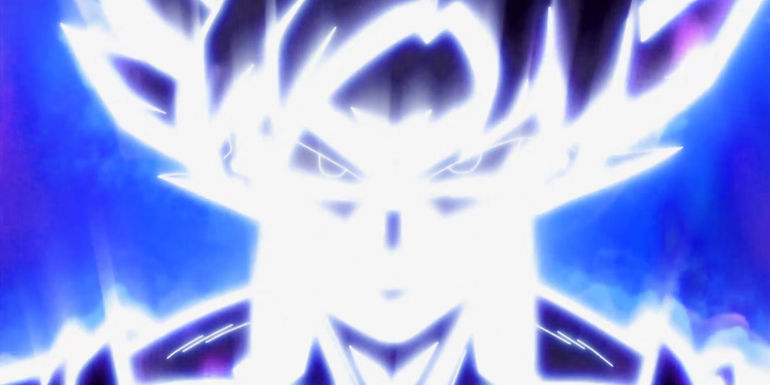 Image shows an image from Dragon Ball Super's anime of Goku's mastered Ultra instinct form that shows him covered in brilliant white light with a blue misty background.