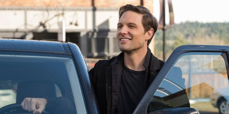 Michael Cassidy's Ethan Stone gets out of his car in Resident Alien season 1
