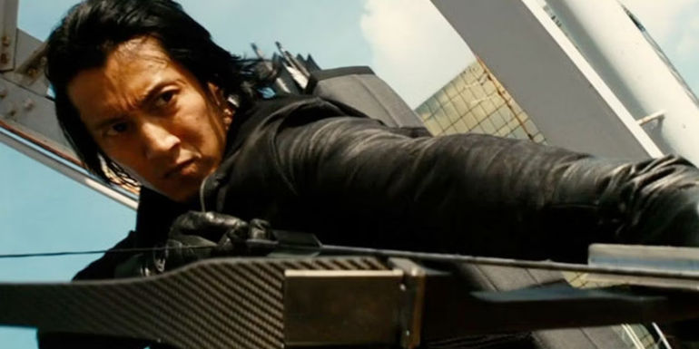 Keunichio Harada pointing a bow and arrow in The Wolverine