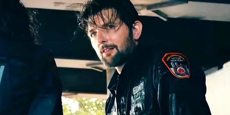 Adam Scott as Ben Parker, wet from jumping into a river in Madame Web