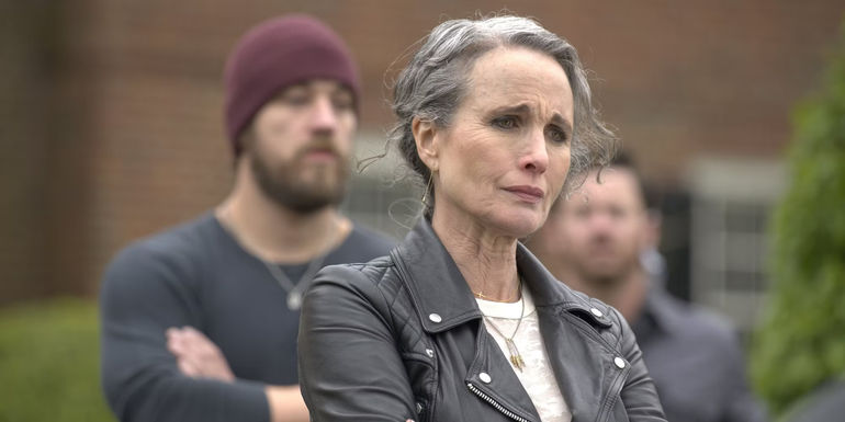 Andie MacDowell crosses her arms while standing in Red Right Hand