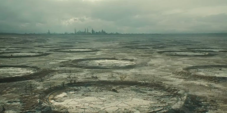 Craters of other Silos with a city in the distance