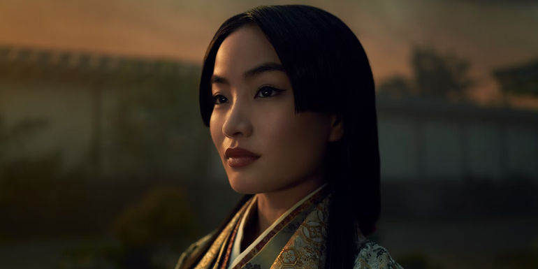 Mariko stands in the garden looking to the side in Shogun