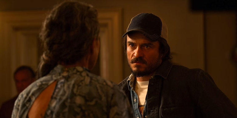 Orlando Bloom looks menacingly at someone in Red Right Hand