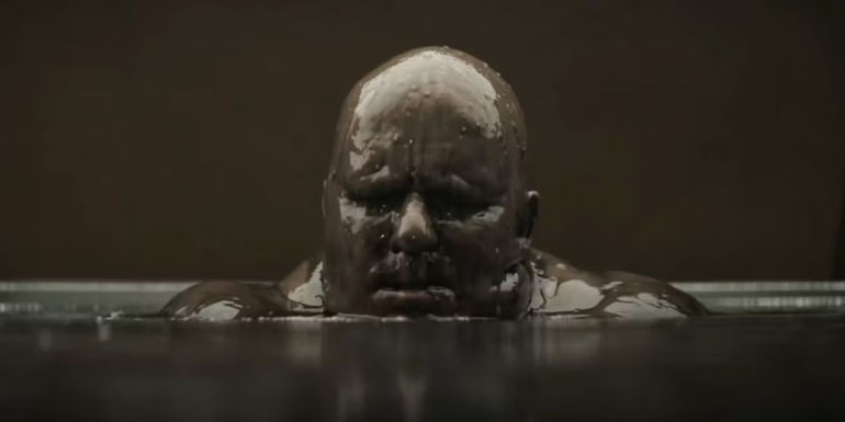 Baron Vladimir Harkonnen emerging from mud in Dune (2021)