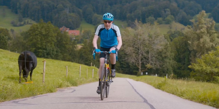 Peter riding a bike in Golden Years