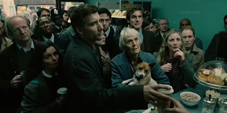A crowd of people standing in a store looking at a TV in Children of Men opening scene - As The World's Population Dies Out, One Woman Holds The Key - Children Of Men (2006)