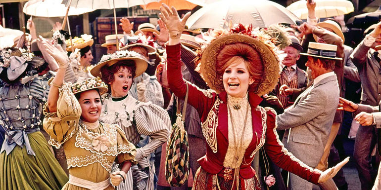 Dolly waving hi in Hello Dolly 1969