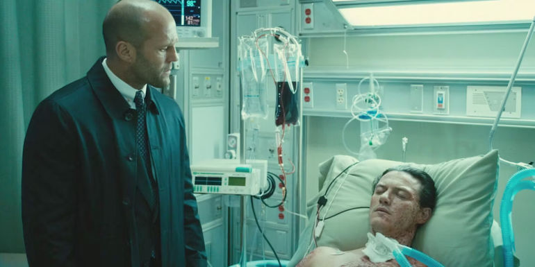 Deckard looking at Owen Shaw in a hospital in Furious 7